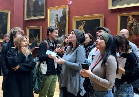 Small group of six guests on a guided Louvre Museum tour near the Venus de Milo
