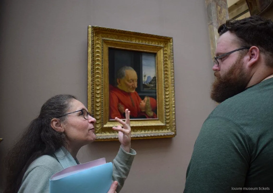Guide explaining a Renaissance portrait of an old man and a child to a guest, seen with Louvre Museum tickets